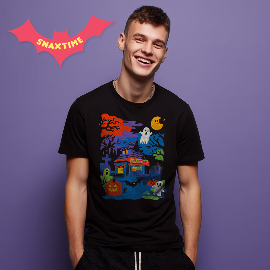 Laughing man wearing a black t-shirt with a haunted Snaxtime stand, ghosts and pumpkins