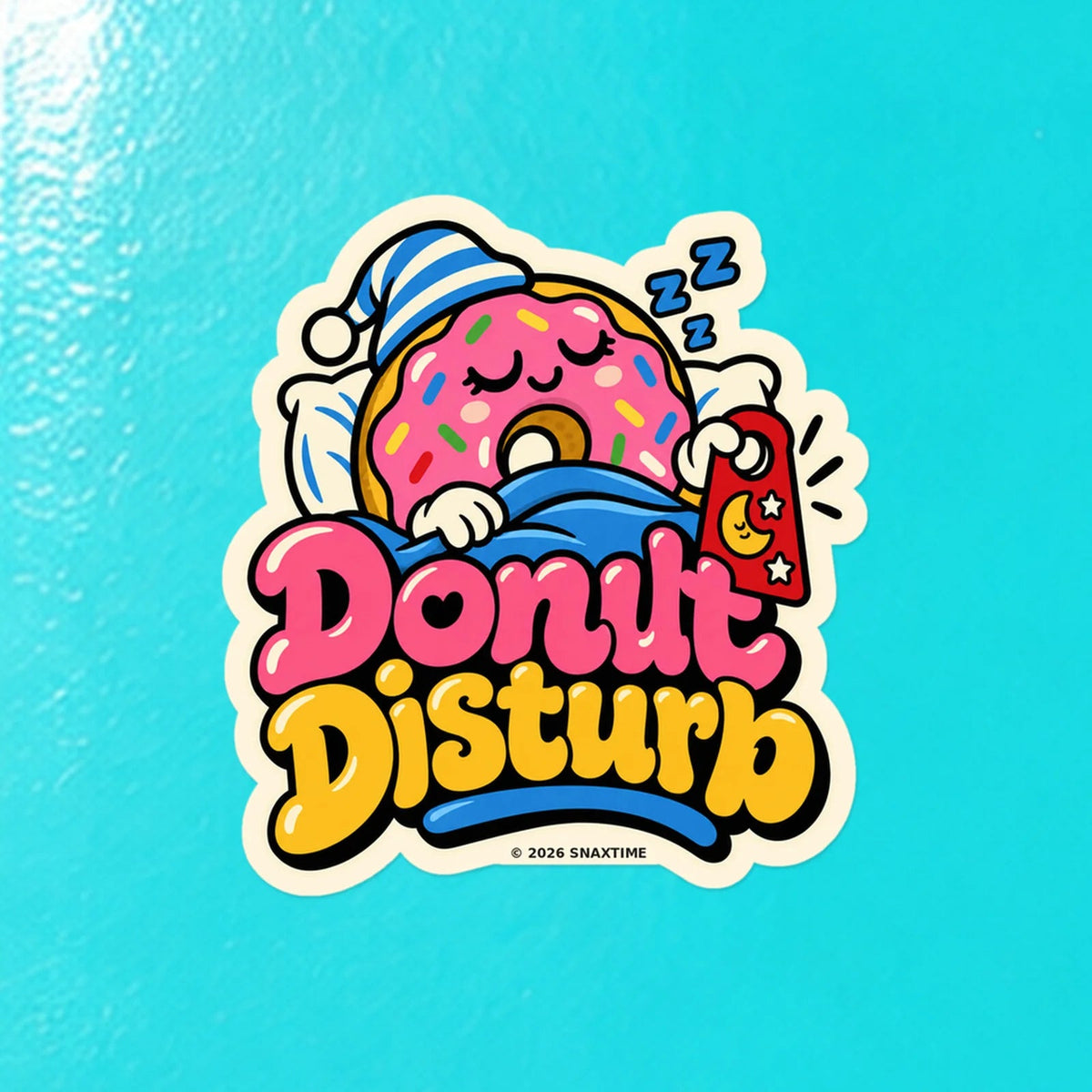 Close-up of the Snaxtime “Donut Disturb” sticker on a skateboard; part of Food Pun Sticker Sheet Set 1.