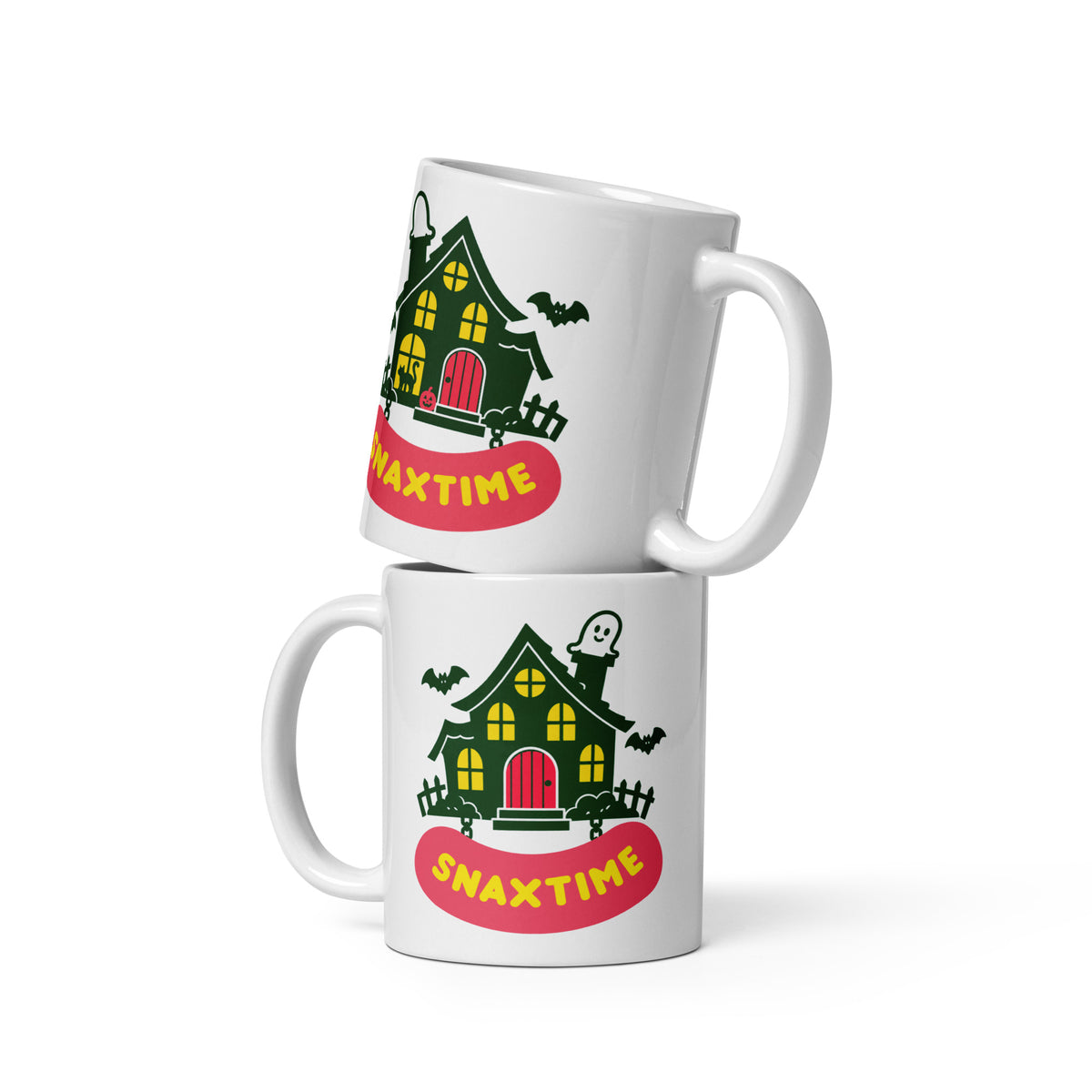 Two stacked white mugs showing both sides of the haunted house design above a pink Snaxtime banner.