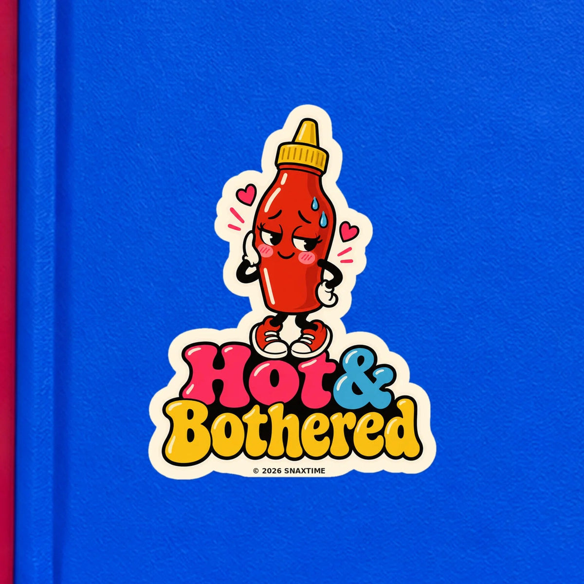 Close-up of the Snaxtime “Hot & Bothered” sticker on a notebook; part of Food Pun Sticker Sheet Set 2.