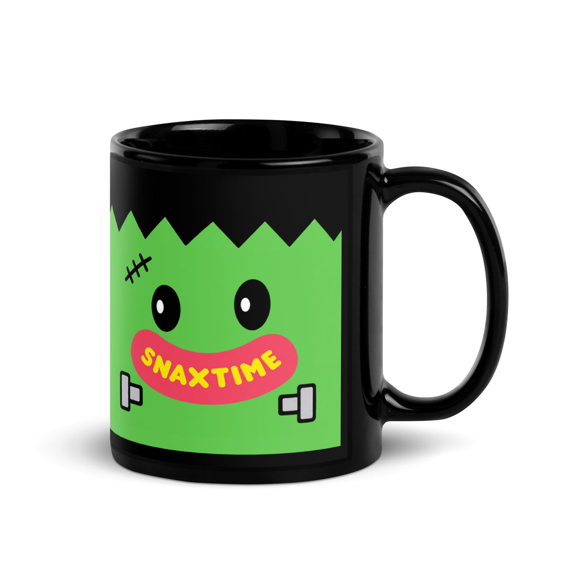 Black 11 oz mug with a green Frankenstein face: stitched scar, round eyes, neck bolts and a pink Snaxtime smile.
