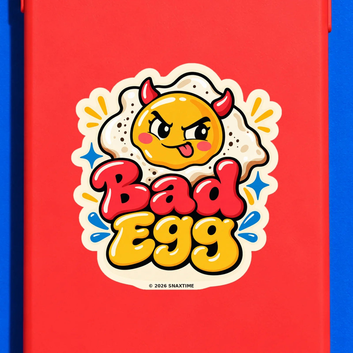 Close-up of the Snaxtime “Bad Egg” sticker on a phone case; part of Food Pun Sticker Sheet Set 3.