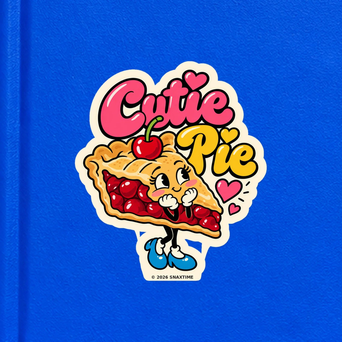 Close-up of the Snaxtime “Cutie Pie” sticker on a notebook; part of Food Pun Sticker Sheet Set 1.