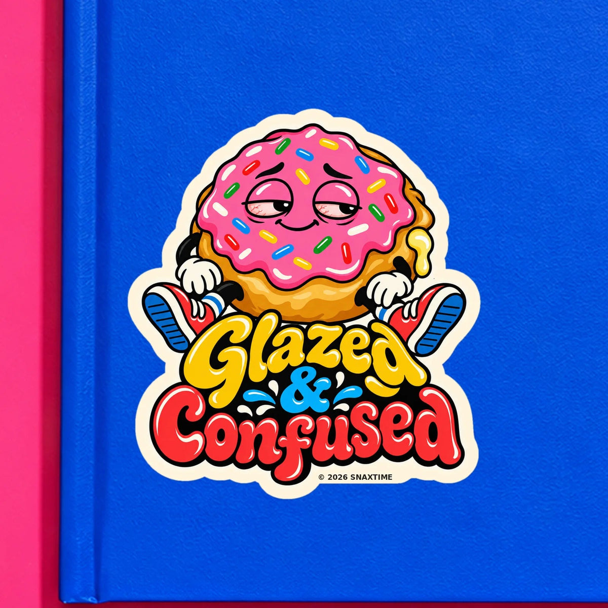 Close-up of the Snaxtime “Glazed & Confused” sticker on a notebook; part of Food Pun Sticker Sheet Set 1.