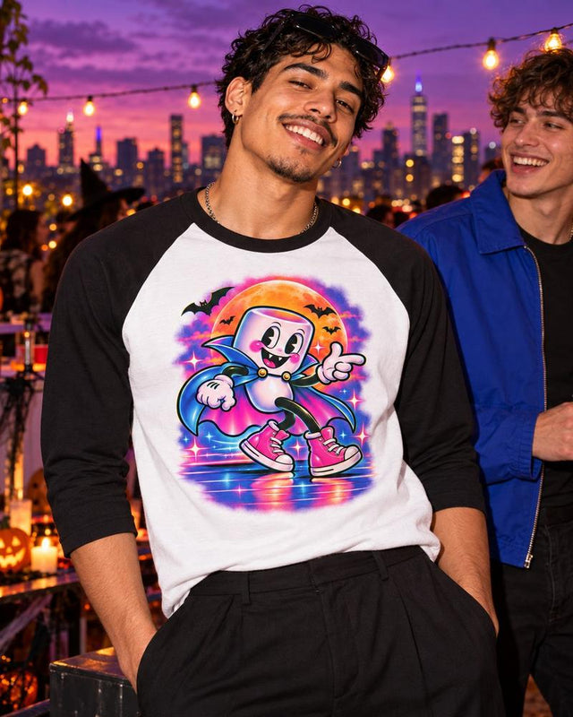 Model wearing the white and black Moonwalk Mallow vampire raglan tee at a rooftop Halloween party.