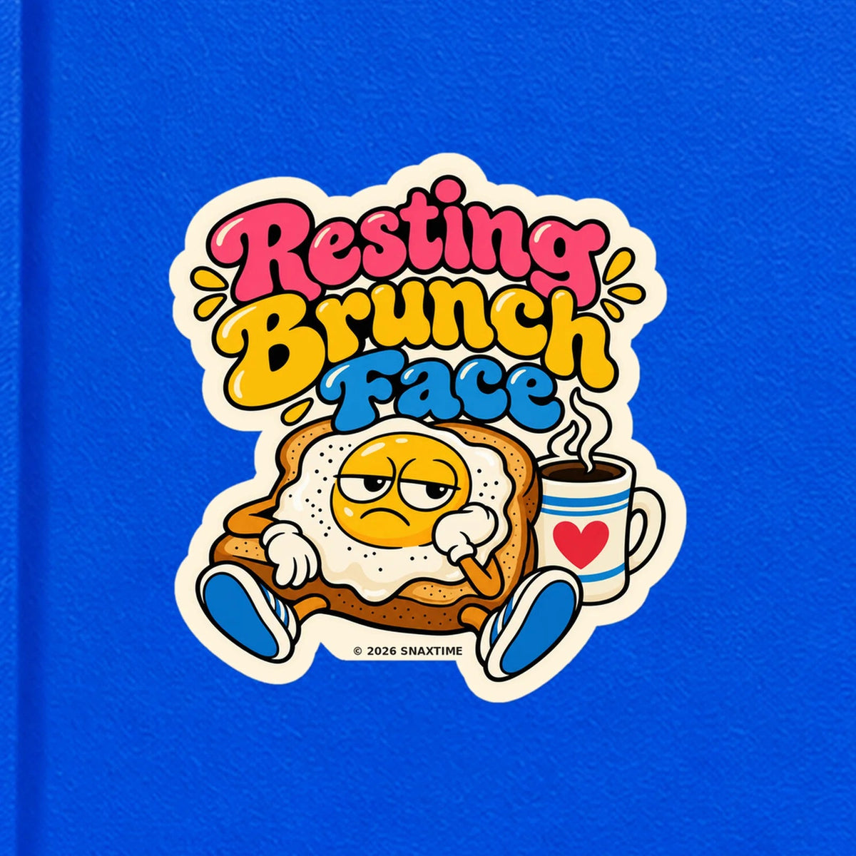 Close-up of the Snaxtime “Resting Brunch Face” sticker on a notebook; part of Food Pun Sticker Sheet Set 1.