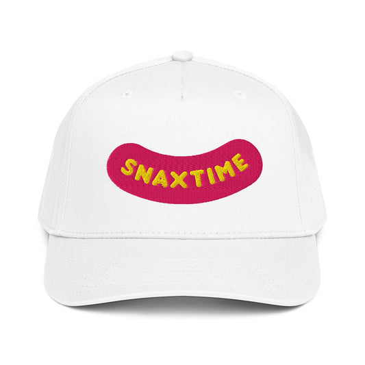Front view of a white five-panel snapback cap with the Snaxtime logo embroidered on the front panel as a raised pink patch with yellow lettering.