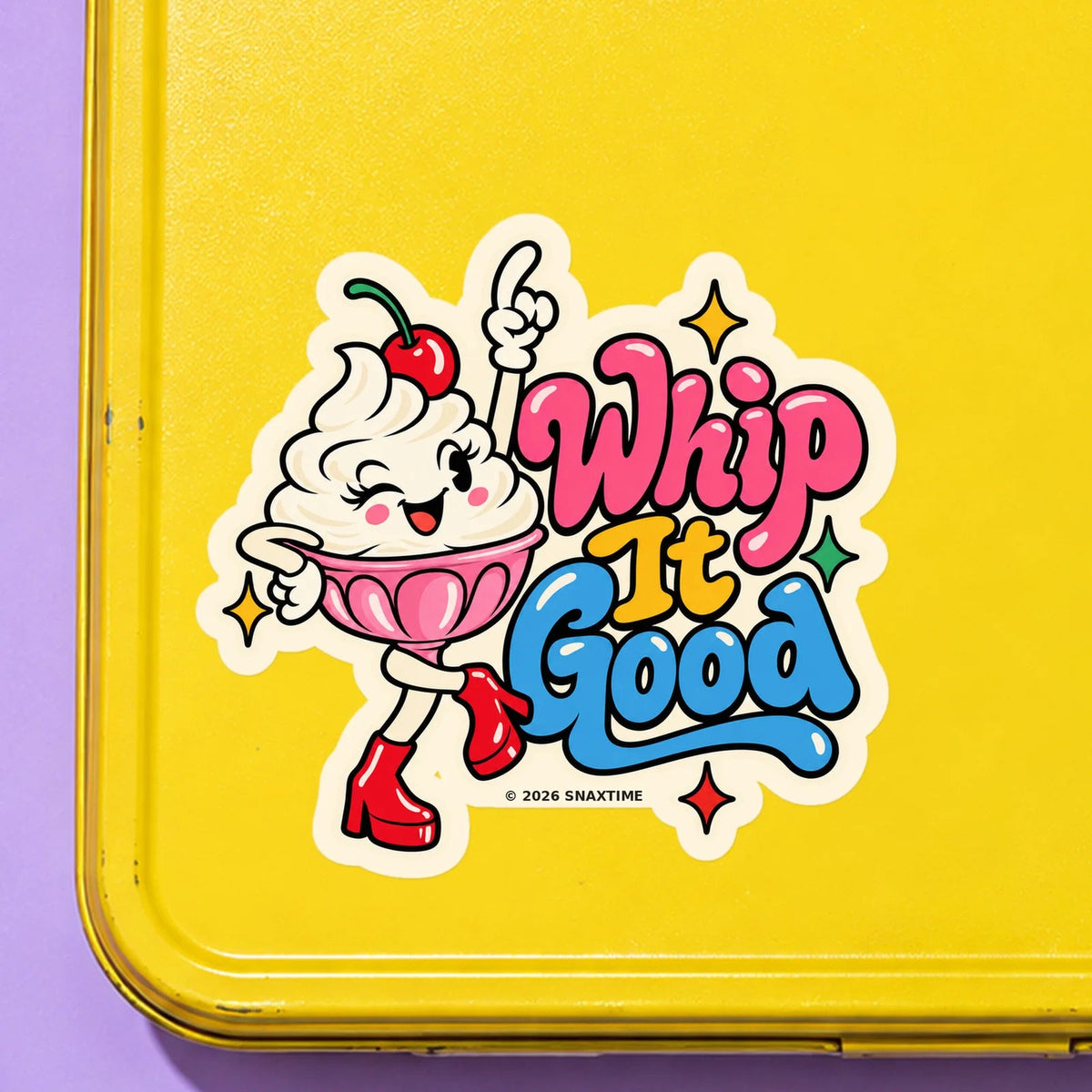 Close-up of the Snaxtime “Whip It Good” sticker on a snack tin; part of Food Pun Sticker Sheet Set 3.