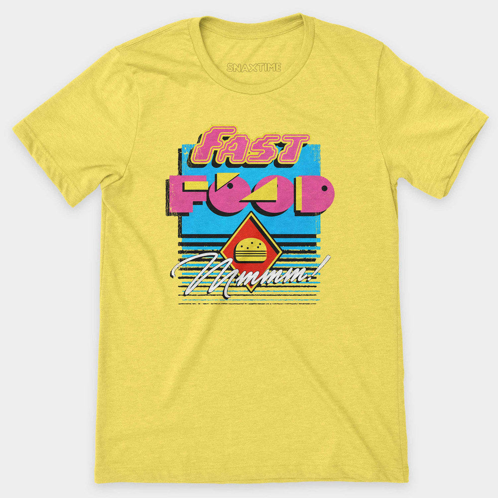 Yellow t-shirt with a neon pink and cyan retro "Fast Food Mmmm!" burger graphic