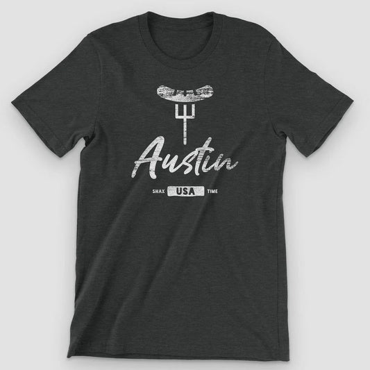 Black heather t-shirt with a white BBQ brisket on a fork above "Austin" script