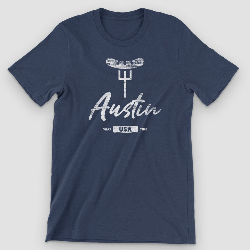 Navy t-shirt with a white brisket-on-a-fork graphic, "Austin" script and a USA badge
