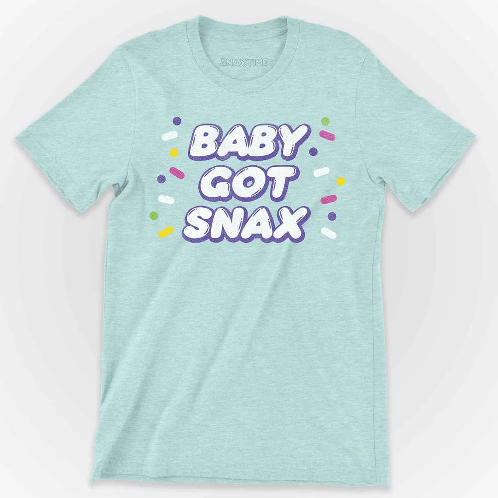 Pale ice blue heather t-shirt with purple-outlined BABY GOT SNAX text and confetti sprinkles