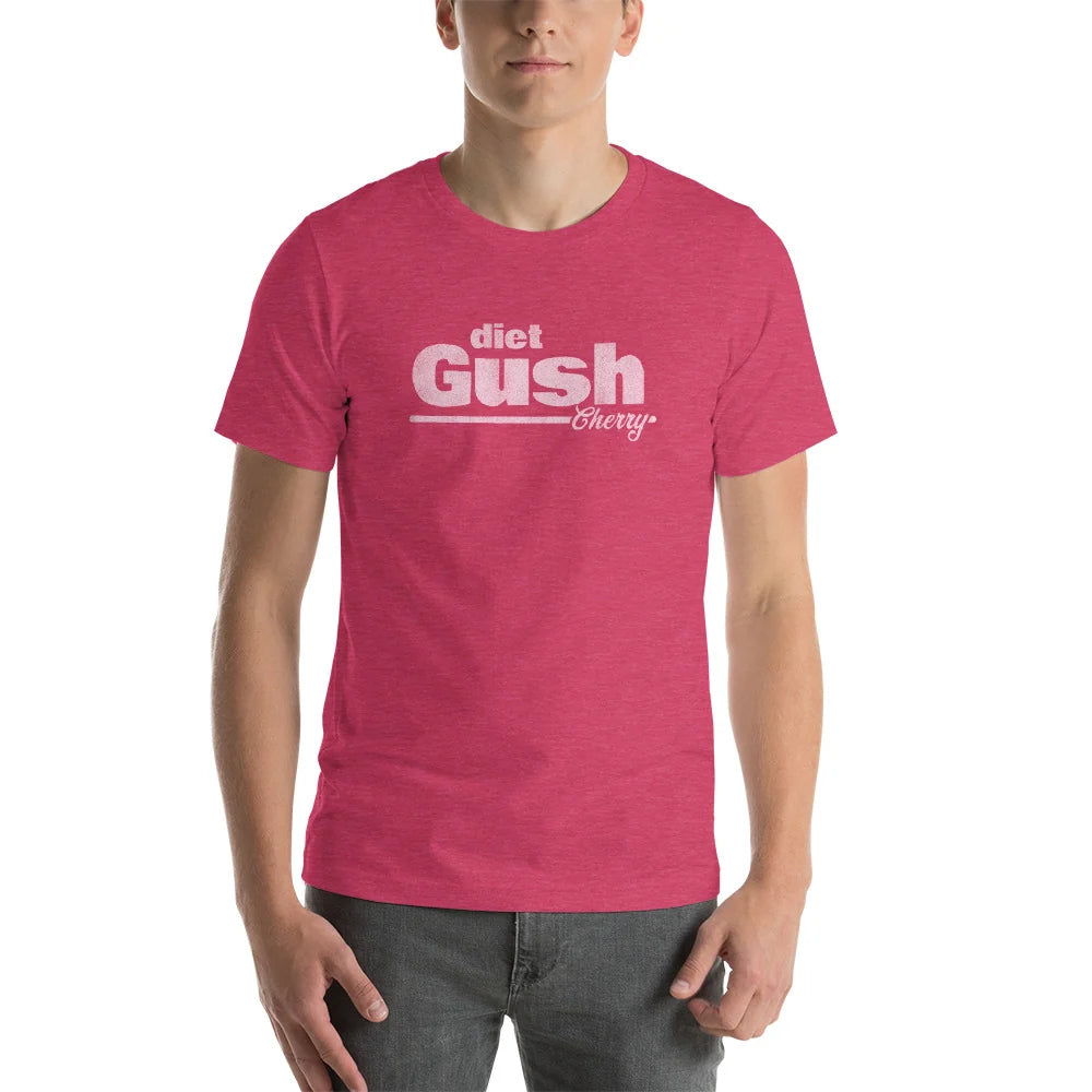 Man wearing the heather pink diet Gush Cherry soda tee with gray jeans