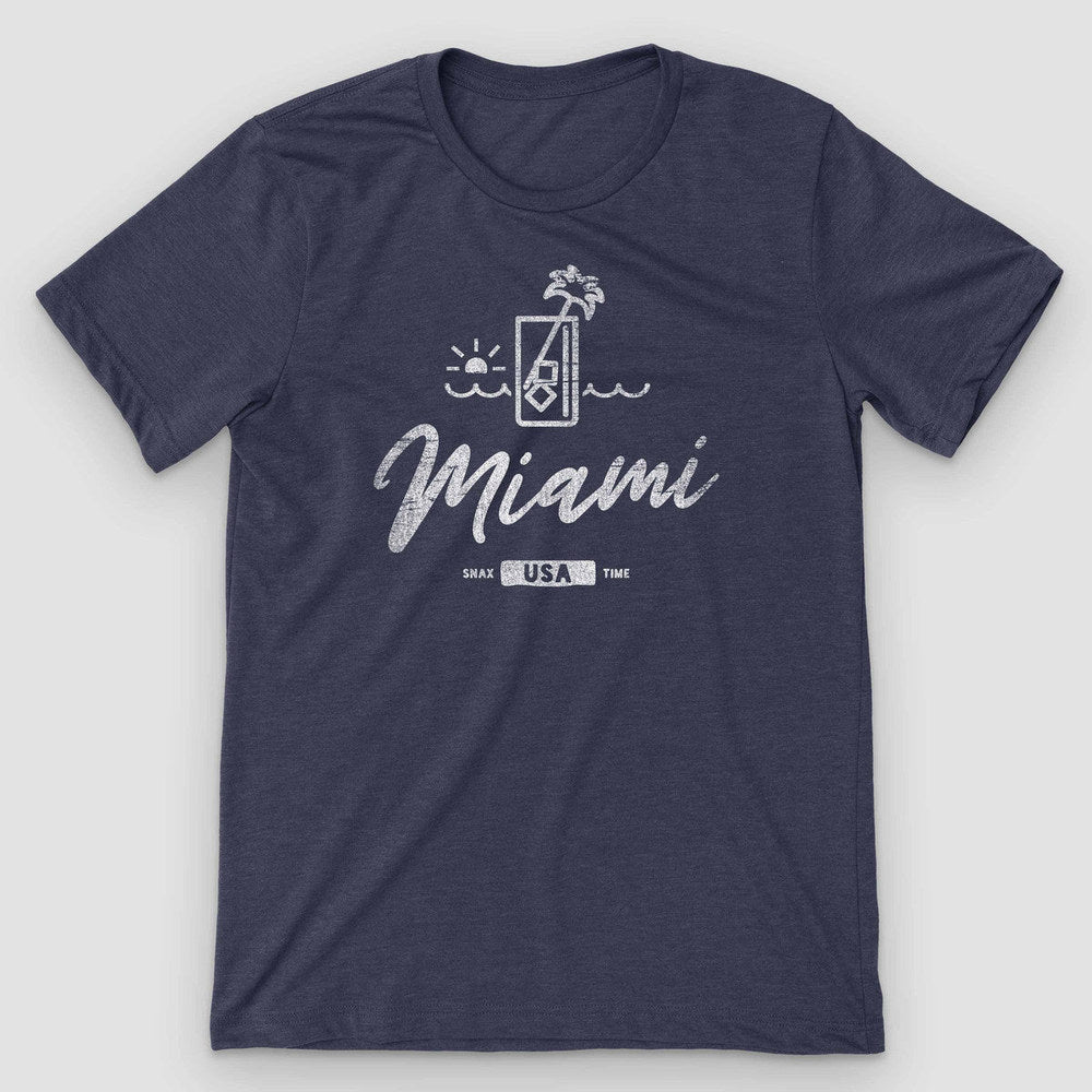 Heather navy t-shirt with a line-art cocktail glass, palm and sunset above Miami script