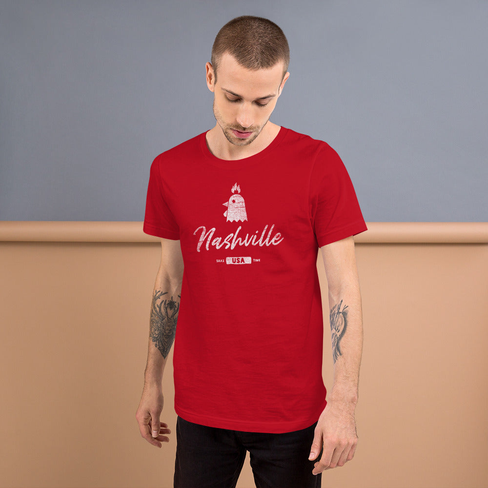 Person looking down in a red Nashville flaming chicken t-shirt against a blue and tan wall