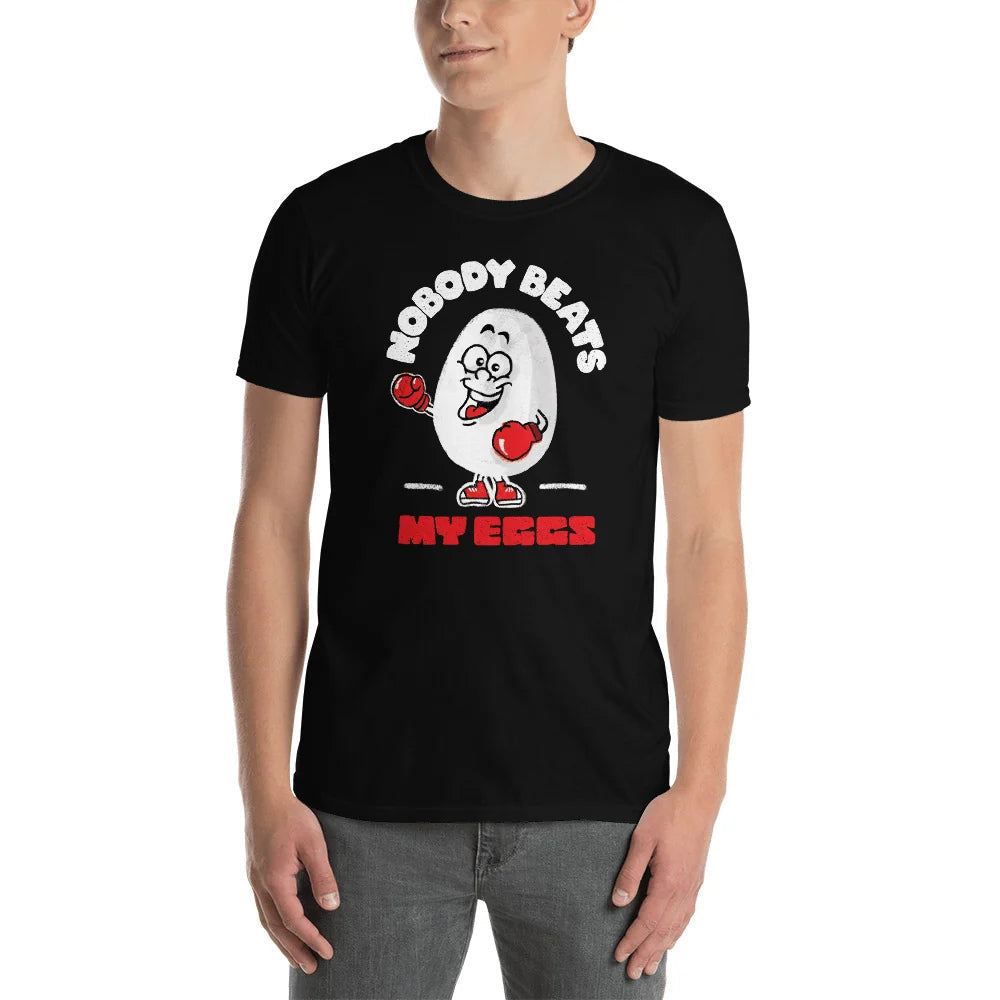 Person wearing a black t-shirt with a boxing cartoon egg and NOBODY BEATS MY EGGS