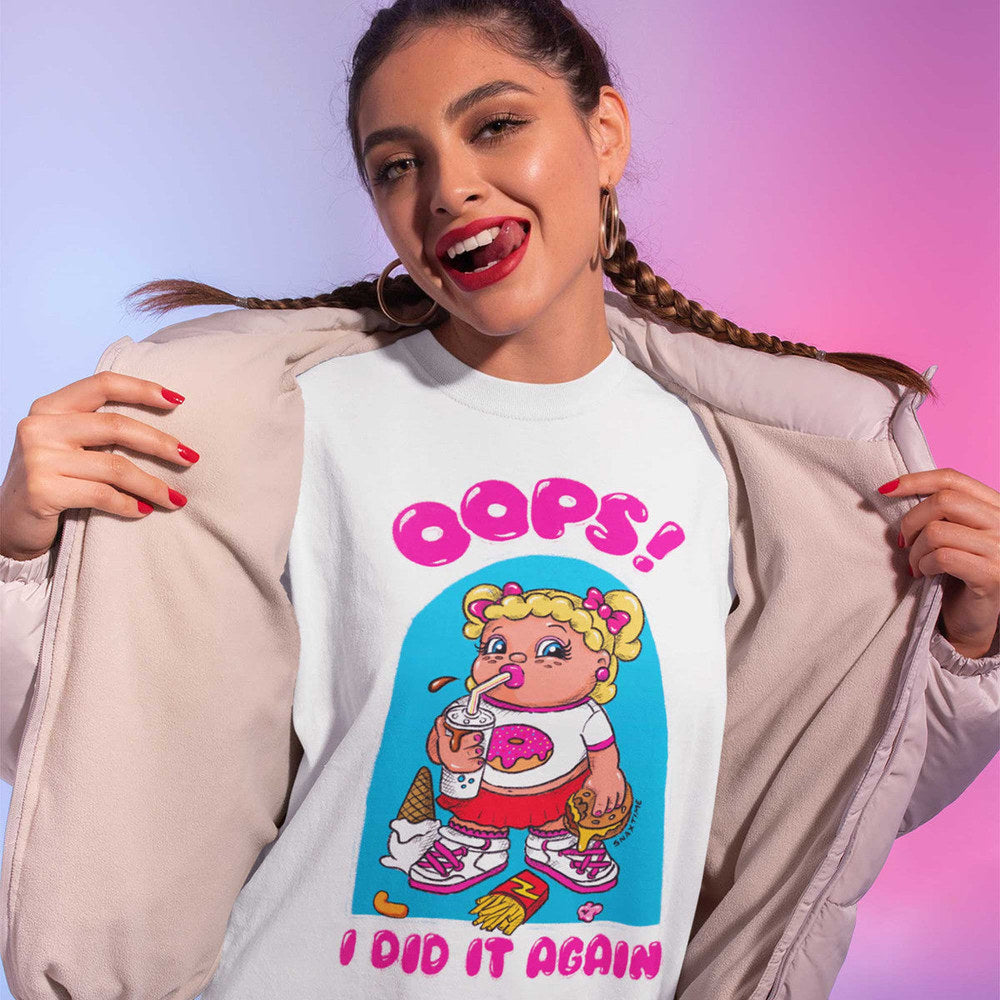Smiling woman in braids opening her jacket over the white cartoon junk food t-shirt