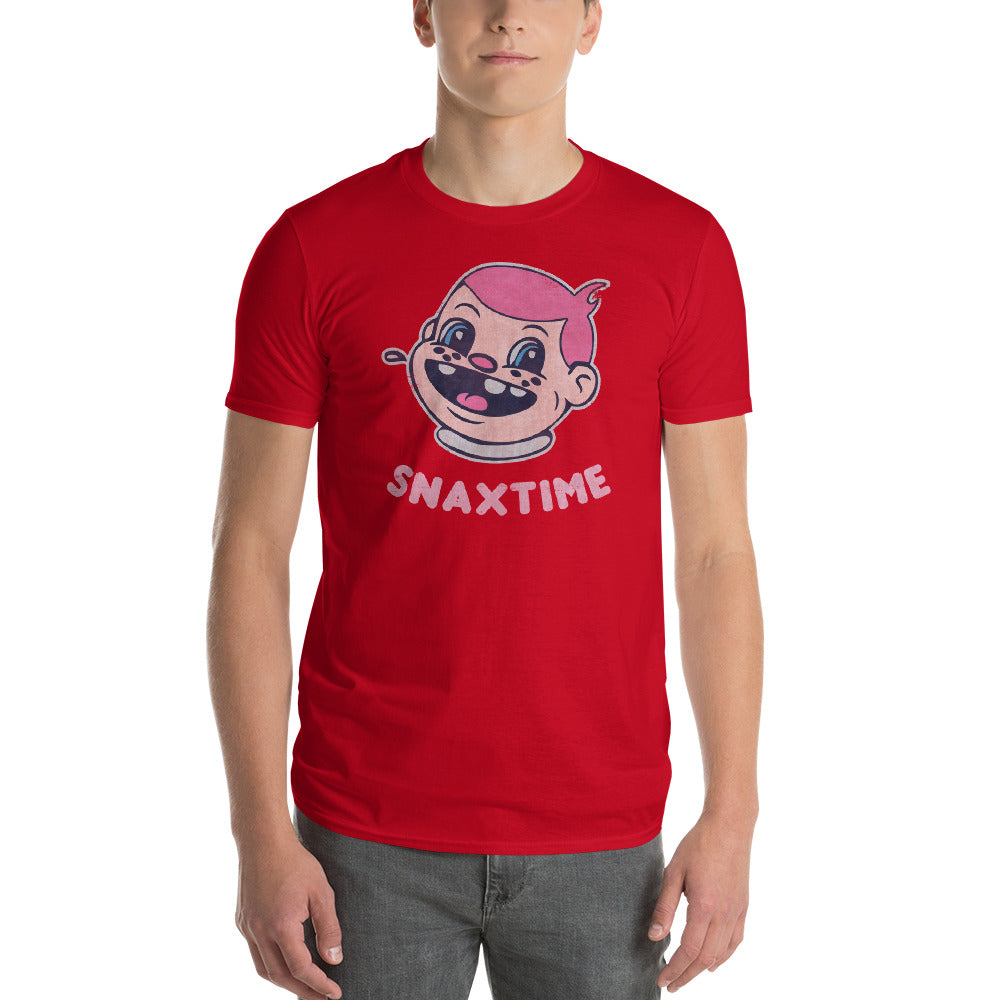 Person wearing a red t-shirt printed with a grinning pink-haired cartoon boy and SNAXTIME lettering