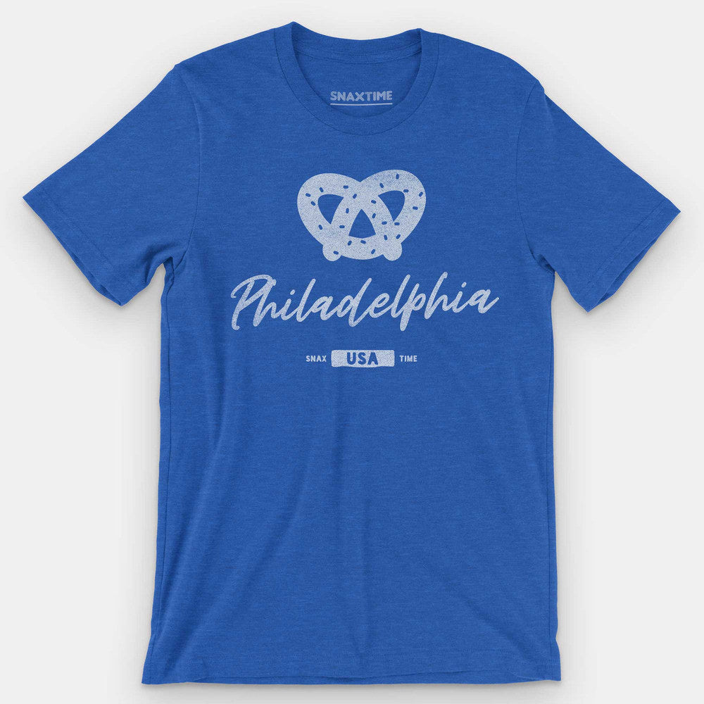 Royal blue t-shirt with a white salted soft pretzel above script "Philadelphia" and a USA badge