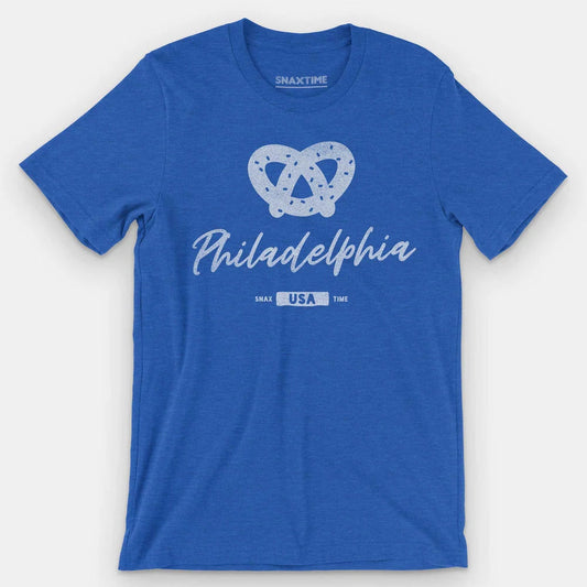 Royal blue t-shirt with a white salted soft pretzel above script "Philadelphia" and a USA badge