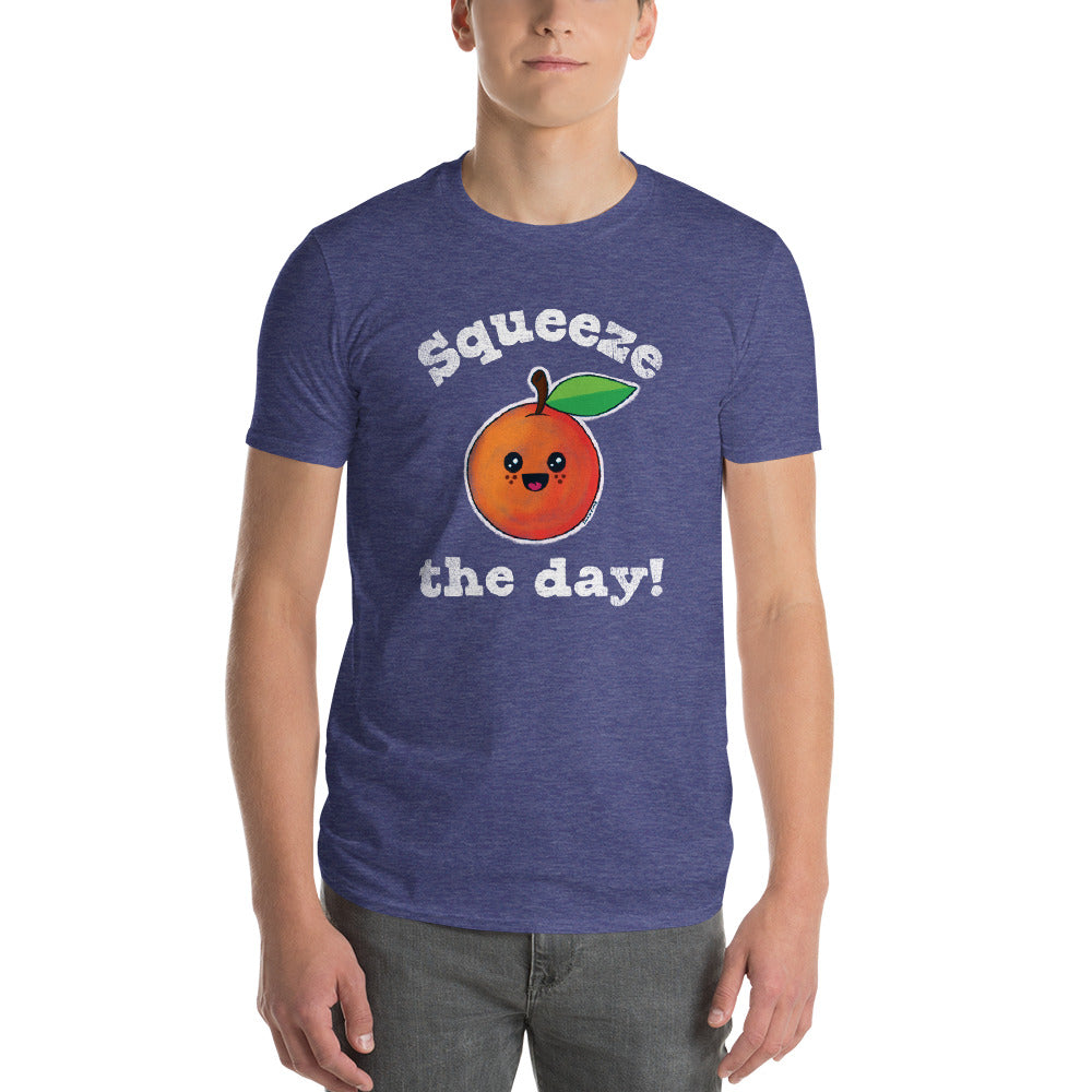 Man wearing the heather blue "Squeeze the day!" kawaii orange t-shirt with gray jeans